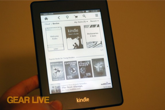 Holding Kindle Paperwhite
