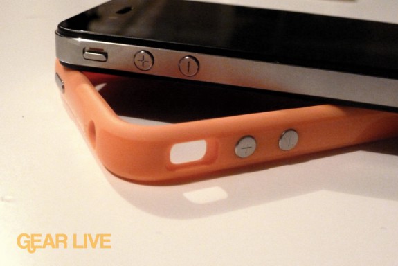 iPhone 4 resting on orange Bumper Case
