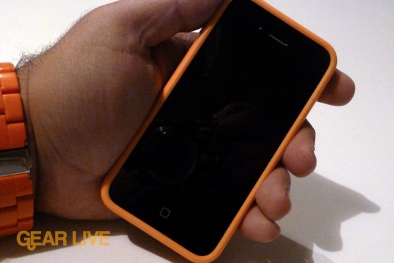 Holding iPhone 4 in orange bumper case