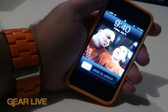 iPhone 4 in orange bumper powered on