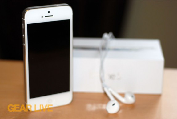 iPhone 5 White & Silver next to box and EarPods